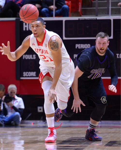 Leah Hogsten  |  The Salt Lake Tribune
Utah Utes forward Jordan Loveridge (21) steals from Carroll College's Jake Hollifield. The University of Utah leads Carroll College 54-23 Tuesday, December 30, 2014 at the Jon M. Huntsman Center.