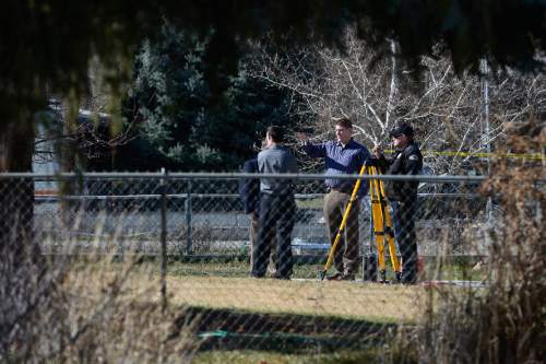 Scott Sommerdorf   |  The Salt Lake Tribune
Police investigators near the scene of an officer-involved shooting in Provo at 1800 West and 600 South, Sunday, Feb. 15, 2015.