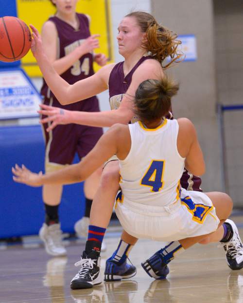 Leah Hogsten  |  The Salt Lake Tribune
Bonneville's Shayla Simpson pulls down Maple Mountain's Elli Eastmond.  Maple Mountain High School girls basketball team defeated Bonneville High School 55-44 during the 4A State Championships first round game, Tuesday, February 17, 2015 at Salt Lake Community College's Lifetime Activities Center .