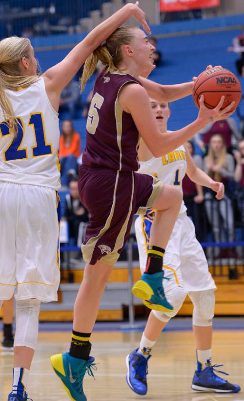 Leah Hogsten  |  The Salt Lake Tribune
Maple Mountain's Liz Eaton is fouled by Bonneville's Mykel Davis. Maple Mountain High School girls basketball team defeated Bonneville High School 55-44 during the 4A State Championships first round game, Tuesday, February 17, 2015 at Salt Lake Community College's Lifetime Activities Center .