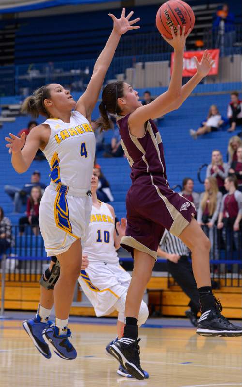 Leah Hogsten  |  The Salt Lake Tribune
Maple Mountain's Nicole Heyn slips past Maple Mountain's Shayla Simpson.  Maple Mountain High School girls basketball team defeated Bonneville High School 55-44 during the 4A State Championships first round game, Tuesday, February 17, 2015 at Salt Lake Community College's Lifetime Activities Center .