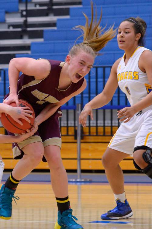 Leah Hogsten  |  The Salt Lake Tribune
Maple Mountain's Liz Eaton fights to keep the ball. Maple Mountain High School girls basketball team defeated Bonneville High School 55-44 during the 4A State Championships first round game, Tuesday, February 17, 2015 at Salt Lake Community College's Lifetime Activities Center .