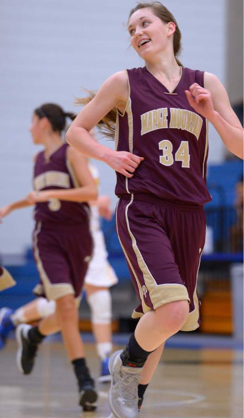 Leah Hogsten  |  The Salt Lake Tribune
Maple Mountain's Mikayla Hubbard celebrates her 3-pointer with the bench. Maple Mountain High School girls basketball team leads Bonneville High School 20-15 during the 4A State Championships first round game, Tuesday, February 17, 2015 at Salt Lake Community College's Lifetime Activities Center .