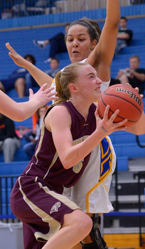 Leah Hogsten  |  The Salt Lake Tribune
Maple Mountain's Liz Eaton gets past Bonneville's Saydee Larsen.   Maple Mountain High School girls basketball team defeated Bonneville High School 55-44 during the 4A State Championships first round game, Tuesday, February 17, 2015 at Salt Lake Community College's Lifetime Activities Center .