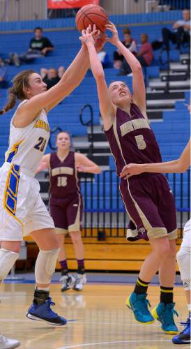 Leah Hogsten  |  The Salt Lake Tribune
Maple Mountain's Liz Easton and Bonneville's Sam Filiaga. Maple Mountain High School girls basketball team defeated Bonneville High School 55-44 during the 4A State Championships first round game, Tuesday, February 17, 2015 at Salt Lake Community College's Lifetime Activities Center .