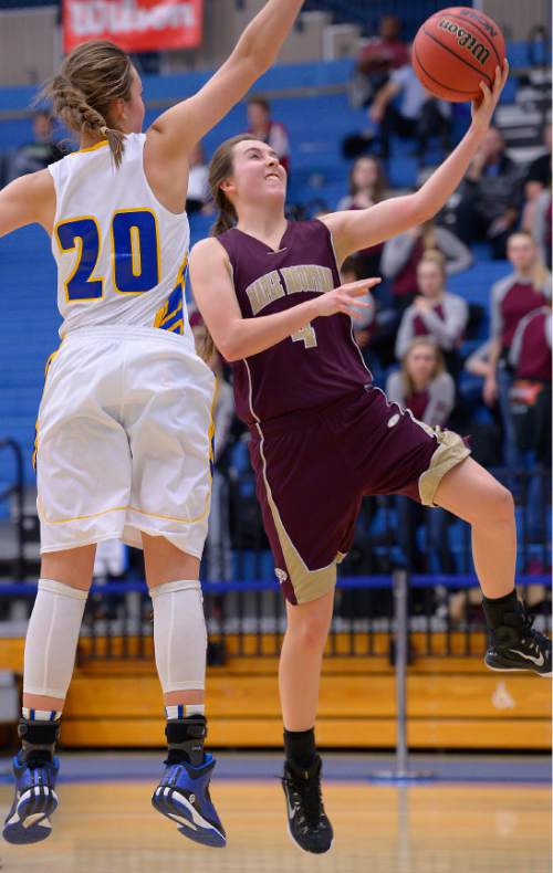 Leah Hogsten  |  The Salt Lake Tribune
Maple Mountain's Elzi Nielsen drives to the net around Bonneville's Sam Filiaga. Maple Mountain High School girls basketball team defeated Bonneville High School 55-44 during the 4A State Championships first round game, Tuesday, February 17, 2015 at Salt Lake Community College's Lifetime Activities Center .