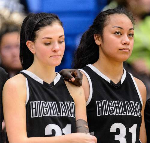 Trent Nelson  |  The Salt Lake Tribune
Highland's Jasmine Hansgen (21) and Highland's Fifita Tonga (31) listen to the school song after the loss, as Mountain View faces Highland in the 4A state basketball tournament at Salt Lake Community College in Taylorsville, Tuesday February 17, 2015. Mountain View wins 54-49.