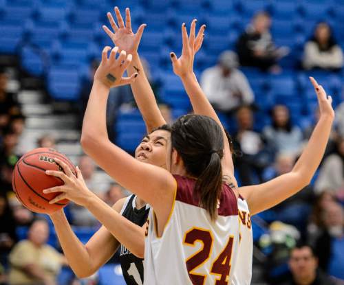 Trent Nelson  |  The Salt Lake Tribune
Highland's Lea Havili (14) looks for a shot, defended by Mountain View's Paulani Tarawa (24), as Mountain View faces Highland in the 4A state basketball tournament at Salt Lake Community College in Taylorsville, Tuesday February 17, 2015. Mountain View wins 54-49.