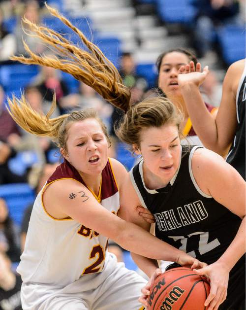 Trent Nelson  |  The Salt Lake Tribune
Mountain View's Amber Hirchak (21) tries to rip the ball from the hands of Highland's Macy Wilson (22) as Mountain View faces Highland in the 4A state basketball tournament at Salt Lake Community College in Taylorsville, Tuesday February 17, 2015.
