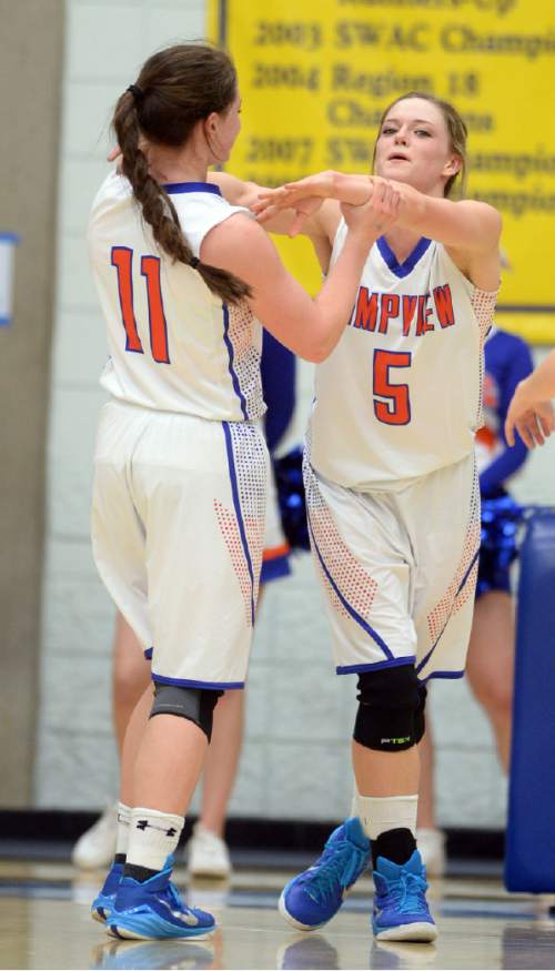 Steve Griffin  |  The Salt Lake Tribune

Timpview's Lacy Haddock (11)  grabs Timpview's Lyndie Haddock (5) in celebration as Timpview pulls away from Logan during opening round of the girl's 4A basketball state tournament at SLCC in Taylorsville, Tuesday, February 17, 2015.