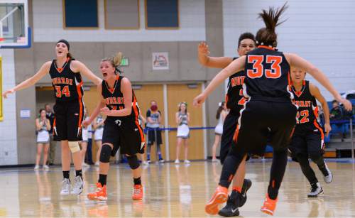 Leah Hogsten  |  The Salt Lake Tribune
Murray celebrates the win. Murray High School girls basketball team defeated Clearfield High School 49-46  during the 4A State Championships first round game, Tuesday, February 17, 2015 at Salt Lake Community College.
