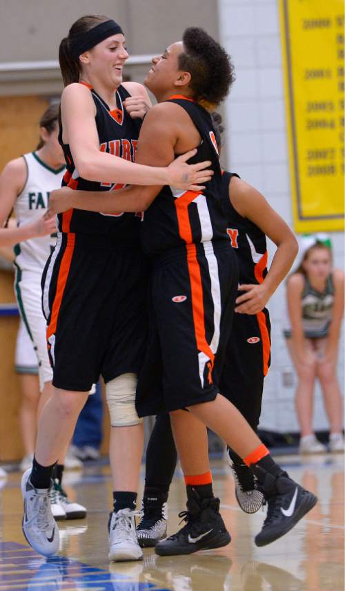 Leah Hogsten  |  The Salt Lake Tribune
 Murray's Deja Frenchwood and Michaela Rueckert celebrate a play. Murray High School girls basketball team defeated Clearfield High School 49-46  during the 4A State Championships first round game, Tuesday, February 17, 2015 at Salt Lake Community College.