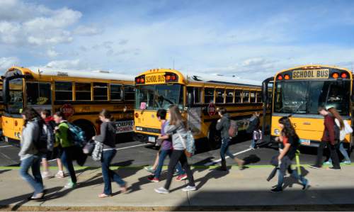 Francisco Kjolseth  |  The Salt Lake Tribune
Over the past several years, Utah school districts have had to absorb higher pension and insurance costs, limiting how far per-pupil spending can go. Kids get ready to head home as they load onto their school buses at Sunset Ridge Middle school in West Jordan on Monday, March 3, 2014.