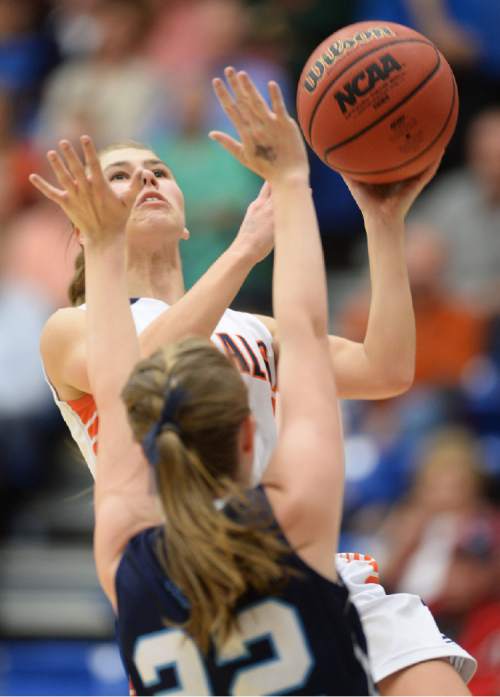 Steve Griffin  |  The Salt Lake Tribune

Brighton's Samantha Smith (4) glides into the lane for a layup over Layton's Joy Christensen (22) during second round of the girl's 5A basketball state tournament at SLCC in Taylorsville, Wednesday, February 18, 2015.