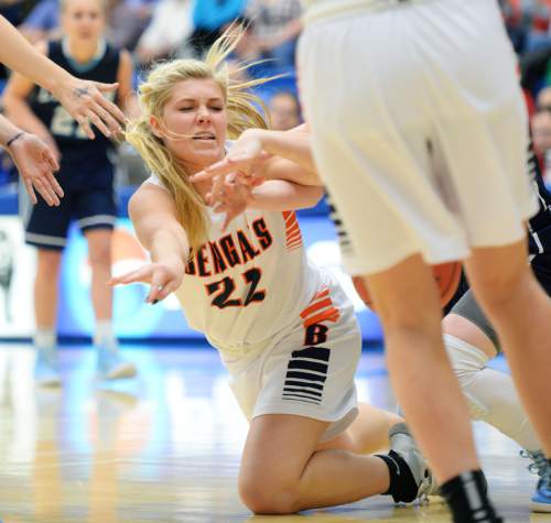 Steve Griffin  |  The Salt Lake Tribune

Brighton's McCall Christensen (22) passes the ball as she falls in the lane during second round game against  Layton of the girl's 5A basketball state tournament at SLCC in Taylorsville, Wednesday, February 18, 2015.