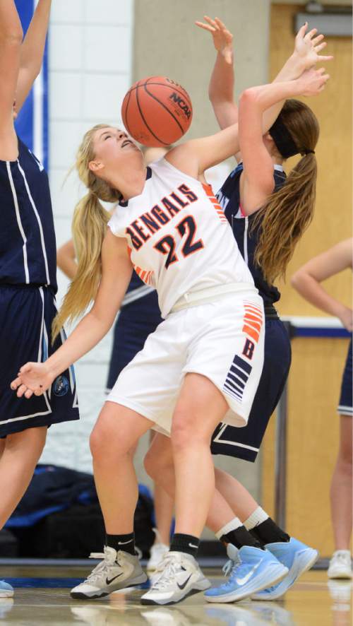 Steve Griffin  |  The Salt Lake Tribune

 Brighton's McCall Christensen (22) uses her left arm to hold off Layton's McKenzie Uitert (23) as a rebound falls to her during second round game of the girl's 5A basketball state tournament at SLCC in Taylorsville, Wednesday, February 18, 2015.