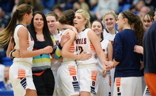 Steve Griffin  |  The Salt Lake Tribune

Brighton's Alyssa Hirschi (11) and Brighton's McCall Christensen (22) hug after the Bengals  victory over Layton during second round game of the girl's 5A basketball state tournament at SLCC in Taylorsville, Wednesday, February 18, 2015.