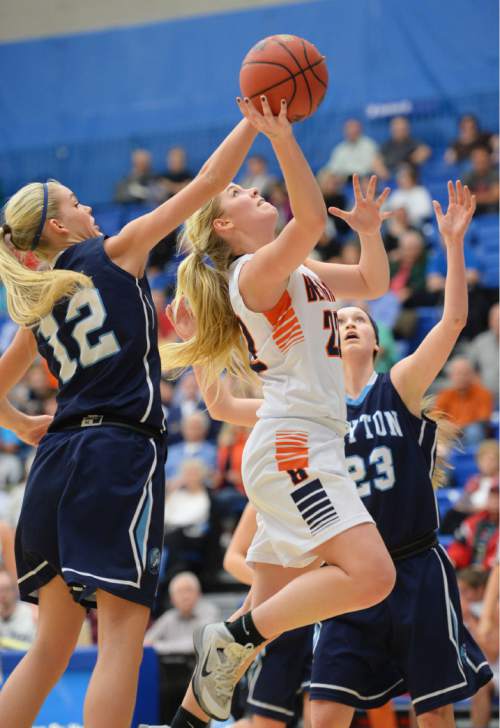 Steve Griffin  |  The Salt Lake Tribune

Layton's Esther Bassett (12) blocks the shot of Brighton's McCall Christensen (22) during second round game of the girl's 5A basketball state tournament at SLCC in Taylorsville, Wednesday, February 18, 2015.