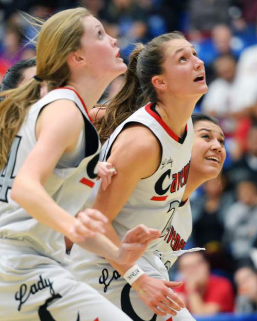Steve Griffin  |  The Salt Lake Tribune

American Fork's Maile Richardson (44), American Fork's Jenna Shepherd (22), and American Fork's Colleen Katoa (33) box out as they look to grab a rebound during second round game against Davis in the girl's 5A basketball state tournament at SLCC in Taylorsville, Wednesday, February 18, 2015.