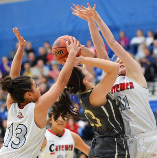 Steve Griffin  |  The Salt Lake Tribune

American Fork's Taylor Moeaki (13) and American Fork's Maile Richardson (44) smother Davis's Meaghan David as she tries to shoot during second round game in the girl's 5A basketball state tournament at SLCC in Taylorsville, Wednesday, February 18, 2015.