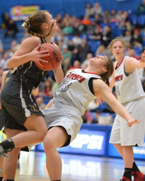 Steve Griffin  |  The Salt Lake Tribune

American Fork's Kylee Andrus (23) draws a charging foul on Davis's Kelsey Higginson in the girl's 5A basketball state tournament at SLCC in Taylorsville, Wednesday, February 18, 2015.