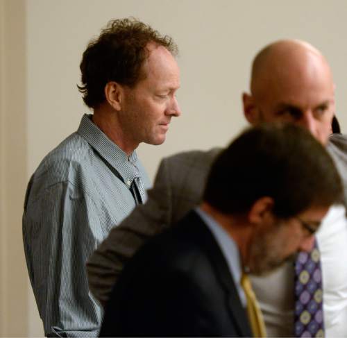 Al Hartmann  |  The Salt Lake Tribune
John Brickman Wall, 51, stands at the defense table during a recess in 3rd District Court Wednesday Feb. 18, 2015. He's accused of killing his ex- wife  Uta von Schwedler. Wall has pleaded not guilty to first-degree felony murder  in connection with Schwedler's death at her Sugar House home in 2011.