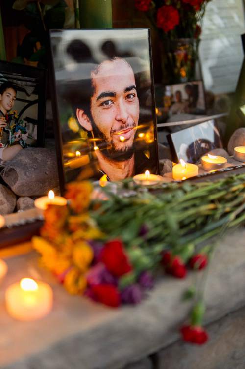 Trent Nelson  |  The Salt Lake Tribune
Photos, notes, flowers and a wooden sword at a memorial to Darrien Hunt Sunday September 14, 2014 at the Saratoga Springs Panda Express, where Hunt was shot and killed by police.