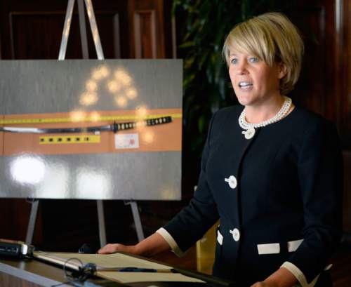 Al Hartmann  |  The Salt Lake Tribune
Attorney Heather White, who is representing Saratoga Springs holds press conference regarding their response to a civil rights lawsuit filed earlier this month by the family of Darrien Hunt, the 22-year-old sword-wielding man who was fatally shot on Sept. 10 2014 by two Saratoga Springs police officers.  To her left is a photo of the sword Hunt was carrying when shot.