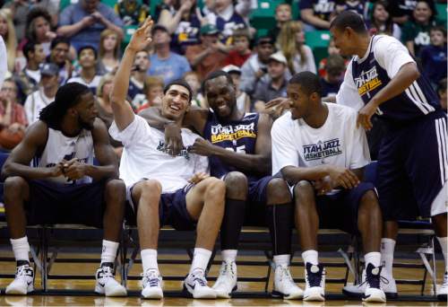 Kim Raff | The Salt Lake Tribune
Jazz players (middle left) Enes Kanter and Al Jefferson wave to the crowd during introductions a the Jazz Scrimmage at EnergySolutions Arena in Salt Lake City, Utah on October 6, 2012.