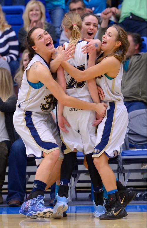 Leah Hogsten  |  The Salt Lake Tribune
Skyline's starters explode off the bench to congratulate teammate Madison Grange #25 who sunk a three-pointer in the final seconds of the game.  Skyline High School girls basketball team  defeated Maple Mountain High School 56-39 during the 4A State Championships semi-final game, Friday, February 20, 2015 at Salt Lake Community College's Lifetime Activities Center.