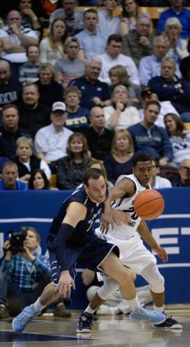 Francisco Kjolseth  |  The Salt Lake Tribune 
Duda Sanadze of Sand Diego battles Anson Winder of BYU for a loose ball in game action at the Marriott Center in Provo on Thursday, Feb. 19, 2015.