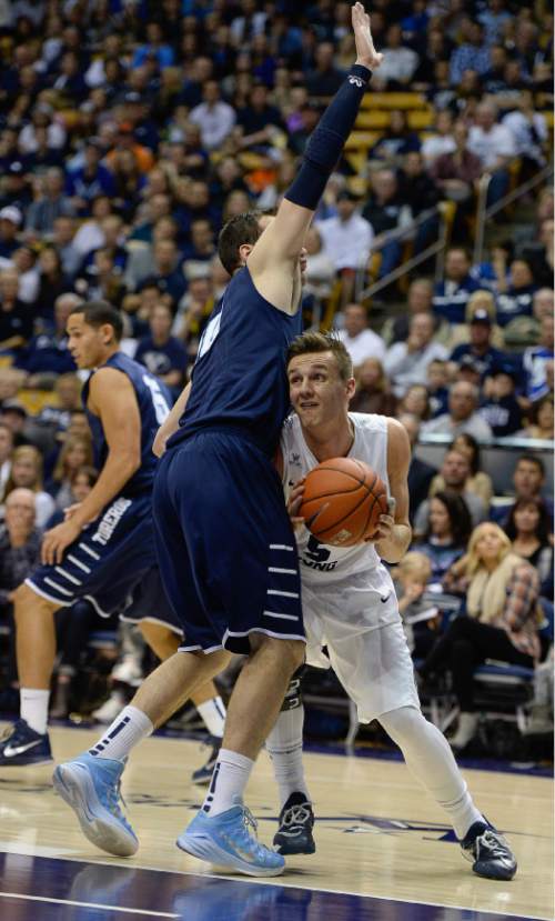 Francisco Kjolseth  |  The Salt Lake Tribune 
Kyle Collinsworth tries to move in from below against San Diego in game action at the Marriott Center in Provo on Thursday, Feb. 19, 2015.
