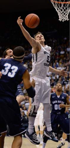 Francisco Kjolseth  |  The Salt Lake Tribune 
Kyle Collinsworth tries to regain control of a rebound against San Diego in game action at the Marriott Center in Provo on Thursday, Feb. 19, 2015.