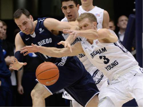 Francisco Kjolseth  |  The Salt Lake Tribune 
Duda Sanadze of San Diego battles Tyler Haws of BYU for a loose ball in game action at the Marriott Center in Provo on Thursday, Feb. 19, 2015.