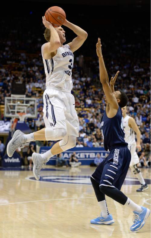 Francisco Kjolseth  |  The Salt Lake Tribune 
Tyler Haws goes high over Chris Anderson of San Diego in game action at the Marriott Center in Provo on Thursday, Feb. 19, 2015.