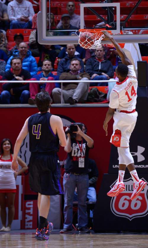 Leah Hogsten  |  The Salt Lake Tribune
Utah Utes guard/forward Dakarai Tucker (14) slams the net. The University of Utah defeated Carroll College 85-49, Tuesday, December 30, 2014 at the Jon M. Huntsman Center.
