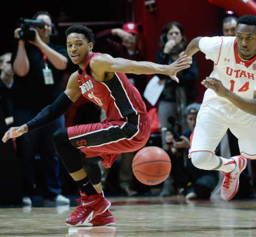 Francisco Kjolseth  |  The Salt Lake Tribune 
Stanford's Anthony Brown chases down a ball with Utah's Dakarai Tucker in game action on Thursday, Feb. 12, 2015, at the Huntsman Center at the University of Utah.