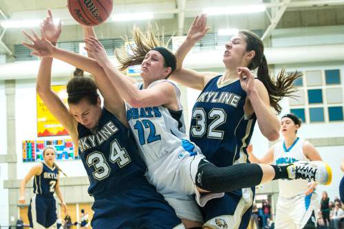 Chris Detrick  |  The Salt Lake Tribune
Skyline's Hillary Weixler (34) Sky View's Kaylee Carlsen (12) Skyline's Laurel Tomlinson (32) go for a rebound during the 4A State Championship game at Salt Lake Community College Lifetime Activities Center  Saturday February 21, 2015. Sky View defeated Skyline 43-32.