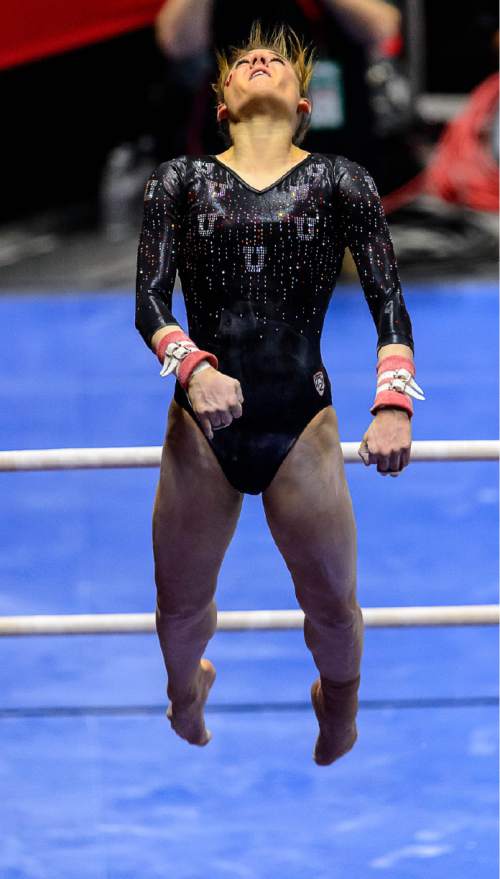 Trent Nelson  |  The Salt Lake Tribune
Utah's Tiffani Lewis on the bars as the University of Utah Utes host Stanford, college gymnastics at the Huntsman Center in Salt Lake City, Saturday February 21, 2015.