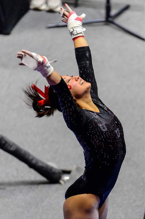 Trent Nelson  |  The Salt Lake Tribune
Utah's Corrie Lothrop on the bars as the University of Utah Utes host Stanford, college gymnastics at the Huntsman Center in Salt Lake City, Saturday February 21, 2015.