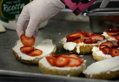 Scott Sommerdorf   |  The Salt Lake Tribune
Emina Dervicevic, a 4th grader at Hillside Elementary builds her entry "Bagel with Ricotta & Strawberries" during the Granite School District 2015 Future Chefs competition on Friday.