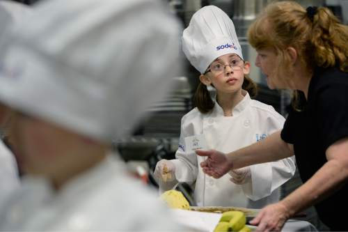 Scott Sommerdorf   |  The Salt Lake Tribune
Emma Herrera, a 4th grader from Armstrong Academy listens carefully to instruction in the Granite Education Center Cafe as she makes "Fruit Pizza"  during the Granite School District 2015 Future Chefs competition, Friday, February 20, 2015.