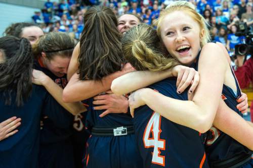Chris Detrick  |  The Salt Lake Tribune
Brighton's Samantha Smith (4) and Asia Kehl hug after winning the 5A State Championship game at Salt Lake Community College Lifetime Activities Center Saturday February 21, 2015.  Brighton won the game 49-40.