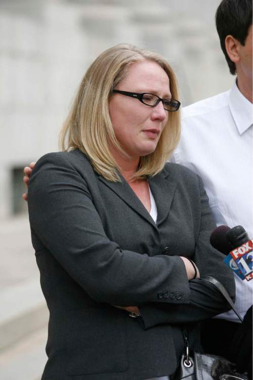 Paul Fraughton  |  The Salt Lake Tribune  Rebecca Ives fights back tears as she talks to the media outside the federal courts building in Salt Lake City on  Monday,February 7, 2011. Ives' son Sam was killed in a bear attach in 2007.