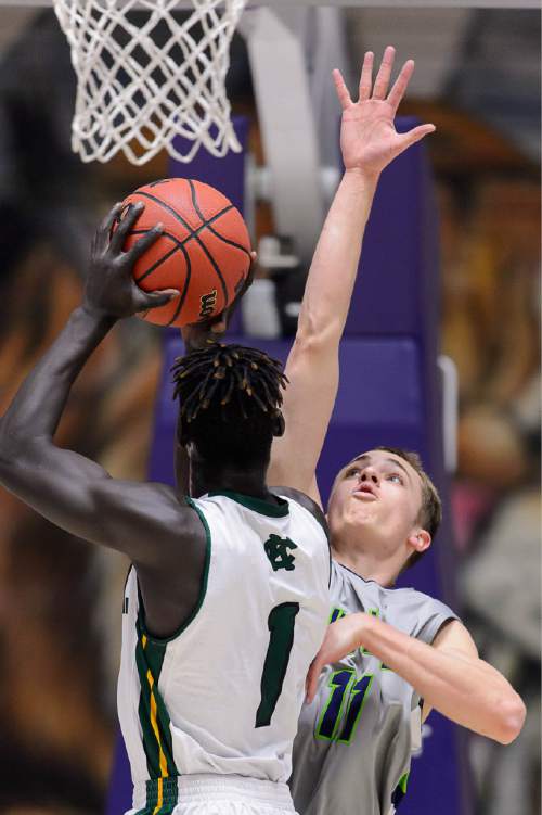 Trent Nelson  |  The Salt Lake Tribune
Timpanogos's Nathan Hale (11) defending Kearns's Bushmen Ebet (1), as Kearns faces Timpanogos High School in the state 4A boys basketball tournament at the Dee Events Center in Ogden, Tuesday February 24, 2015.