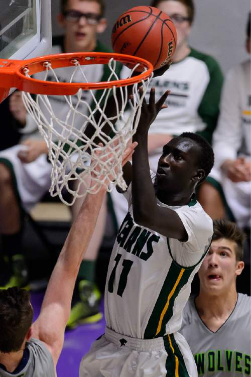 Trent Nelson  |  The Salt Lake Tribune
Kearns's Buay Kuajian (11) ties the game late in the fourth quarter as Kearns faces Timpanogos High School in the state 4A boys basketball tournament at the Dee Events Center in Ogden, Tuesday February 24, 2015.