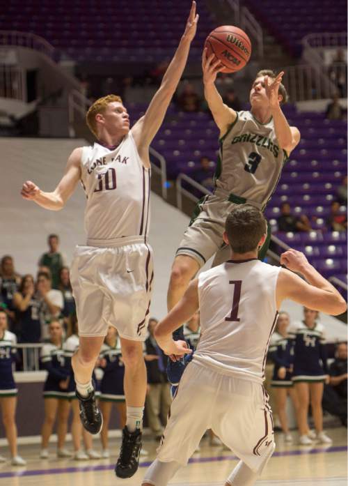 Rick Egan  |  The Salt Lake Tribune

Copper Hills forward Bailey Brooks (3) goes for the basket,  as Lone Peak forward Dylan Hedin (30) and Tyson Doman (1) defend,  in 5A Boys Basketball StateTournament action, Lone Peak vs Copper Hills, at the Dee Event Center, Monday, February 23, 2015