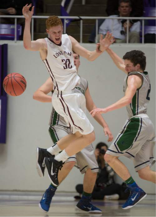 Rick Egan  |  The Salt Lake Tribune

Copper Hills guard Charlie Olsen (21) strips the ball from Lone Peak forward Dylan Hedin (30), in 5A Boys Basketball StateTournament action, Lone Peak vs Copper Hills, at the Dee Event Center, Monday, February 23, 2015