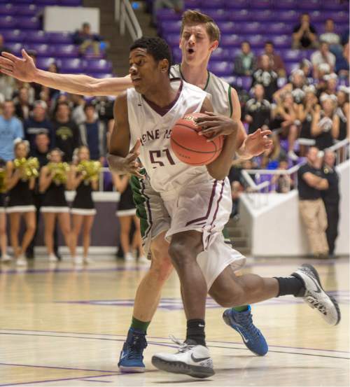 Rick Egan  |  The Salt Lake Tribune

Lone Peak guard Christian Popoola (51) gets past Copper Hills forward Bailey Brooks (3), in 5A Boys Basketball StateTournament action, Lone Peak vs Copper Hills, at the Dee Event Center, Monday, February 23, 2015