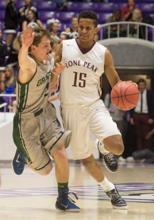 Rick Egan  |  The Salt Lake Tribune

Lone Peak guard Franklin Jackson (15) brings the ball down court as Copper Hills guard Trevor Hoffman (2) denends, in 5A Boys Basketball StateTournament action, Lone Peak vs Copper Hills, at the Dee Event Center, Monday, February 23, 2015